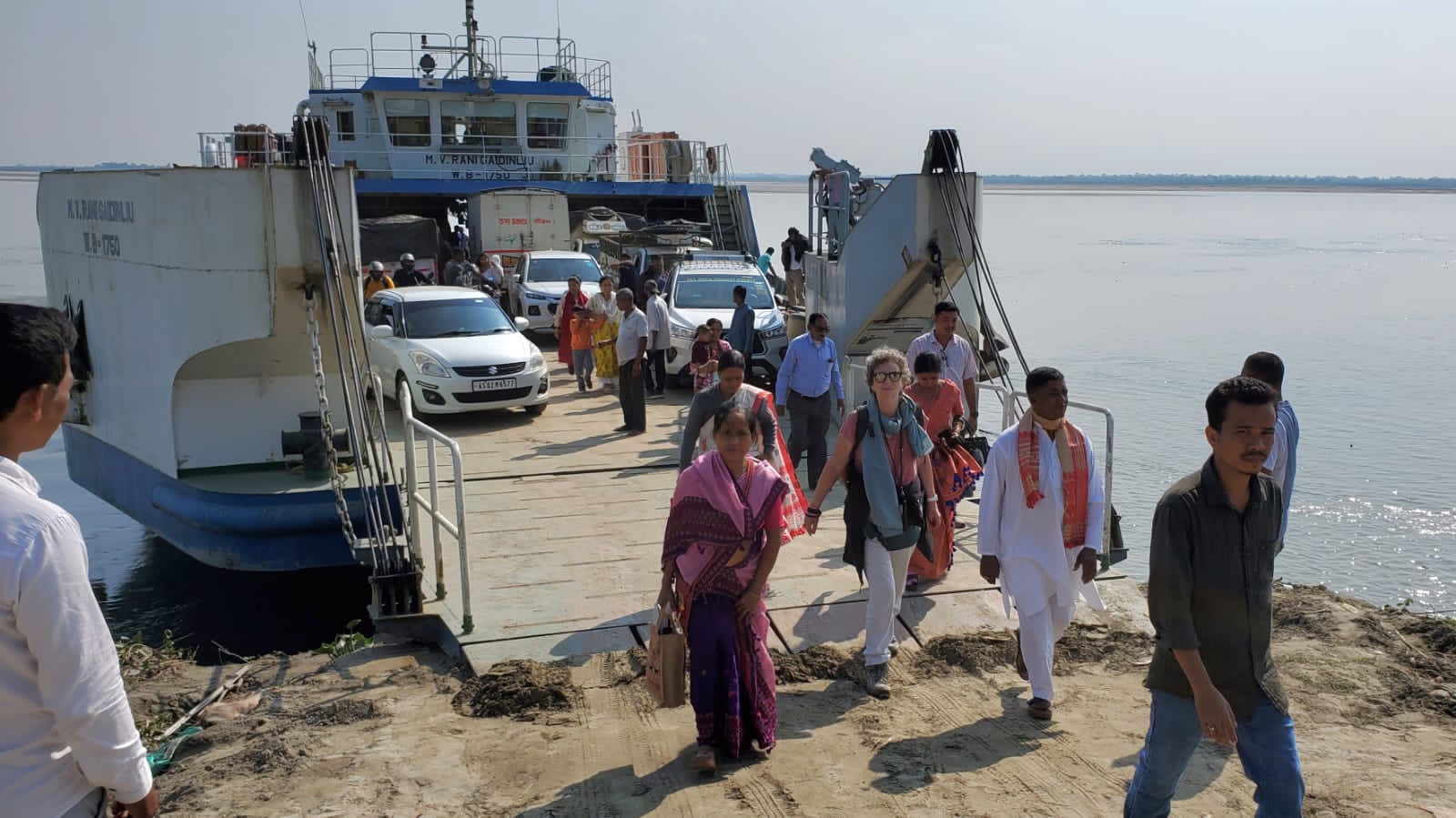 Passengers and vehicles disembarking from the Brahmaputra ferry that connects the mainland to Majuli island